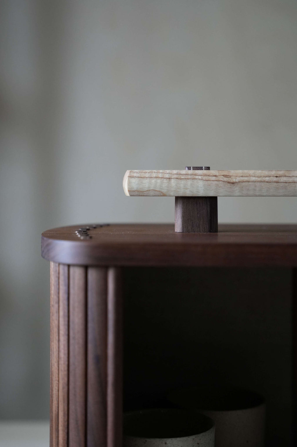 Wooden box with handle and tambour doors closeup