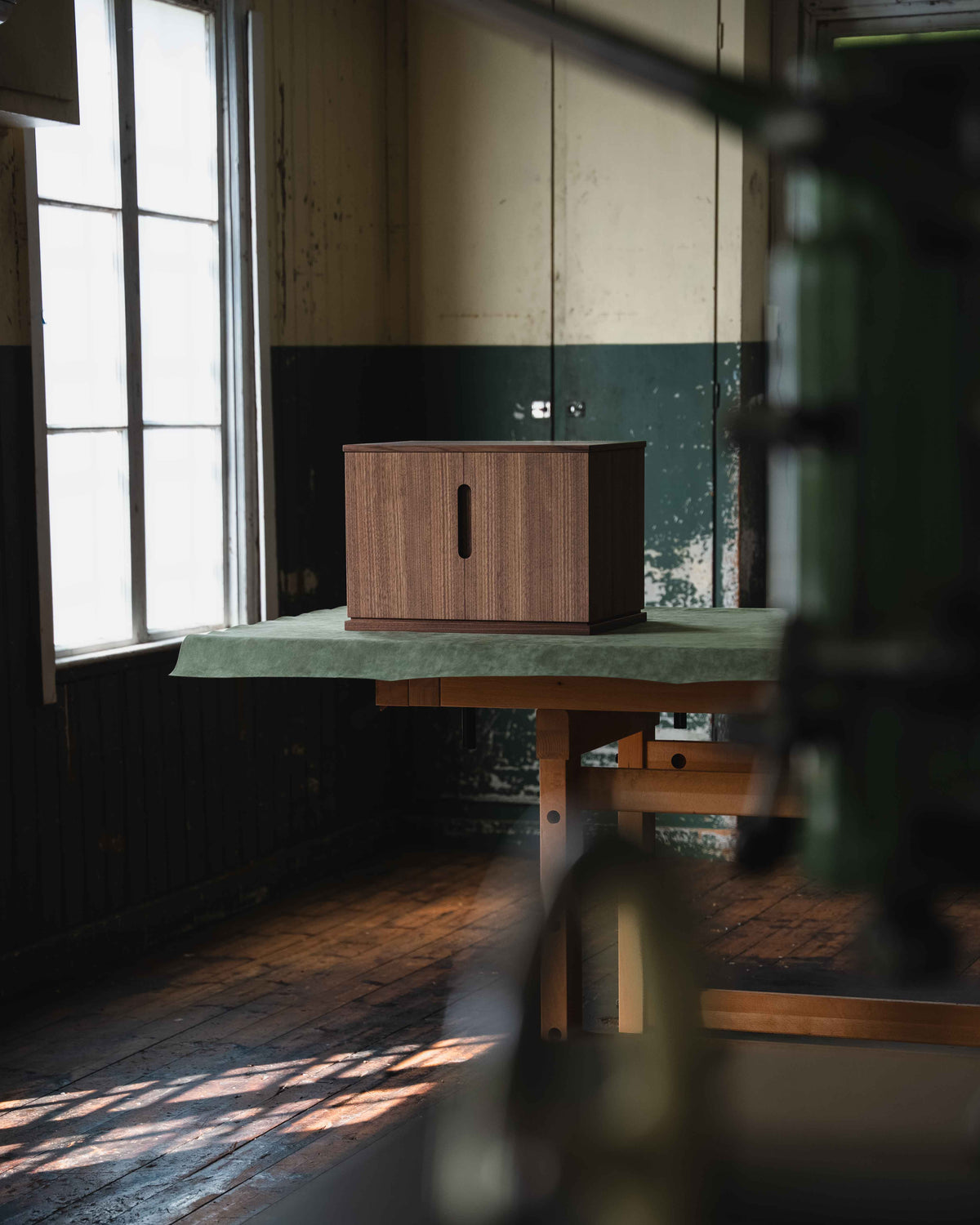 Exclusive walnut jewelry chest with doors half open in od form's workshop in Sweden