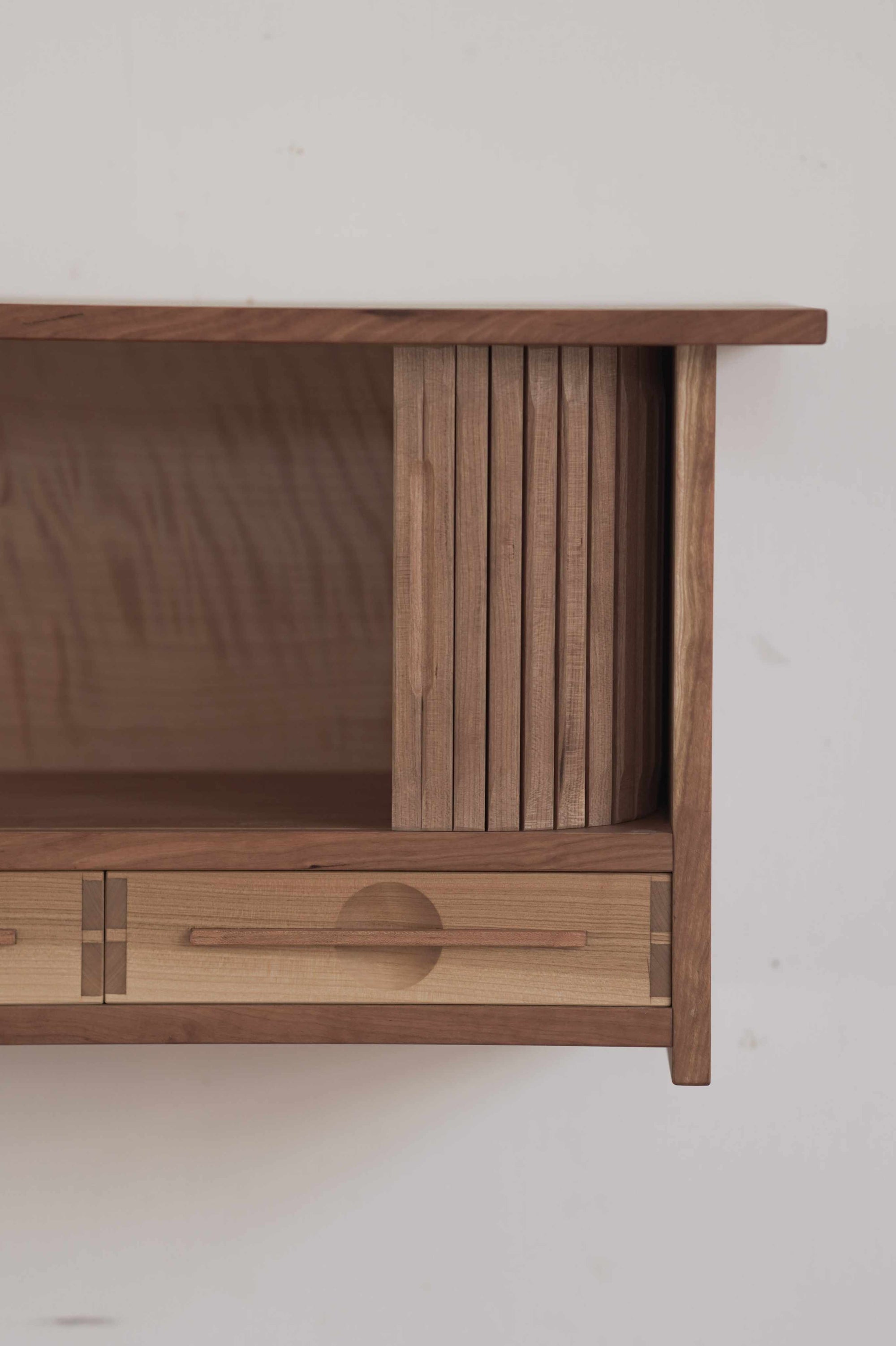 Wooden cabinet with a minimalist design on a plain background